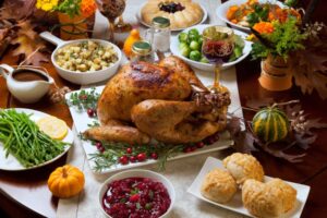 a Thanksgiving dinner spread on a dinner table